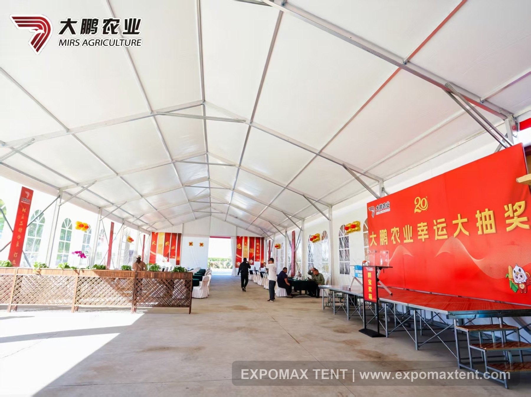 Agriculture brand activity held inside a clear-span tent