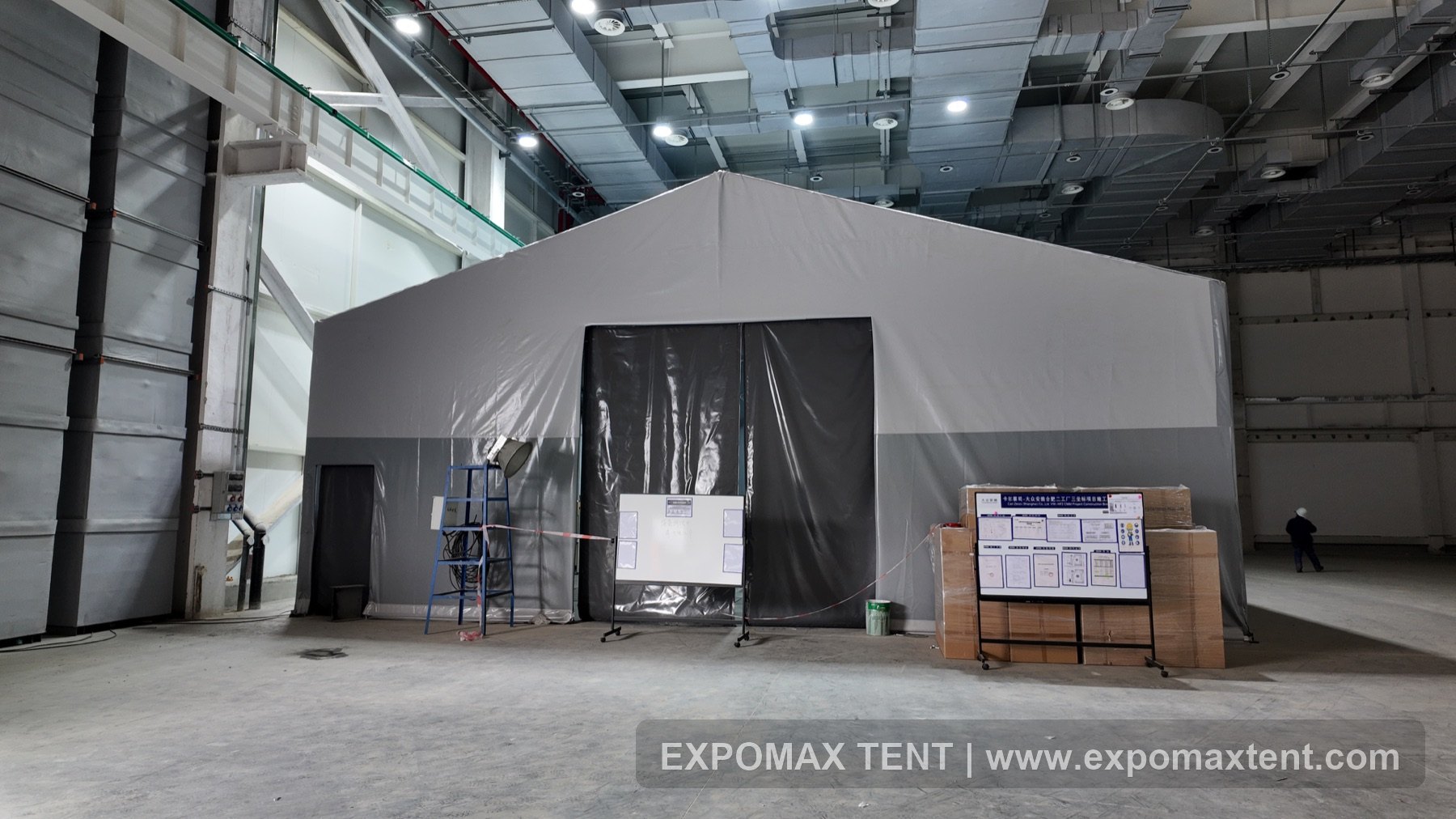 Insulated temporary tent built inside an industrial building