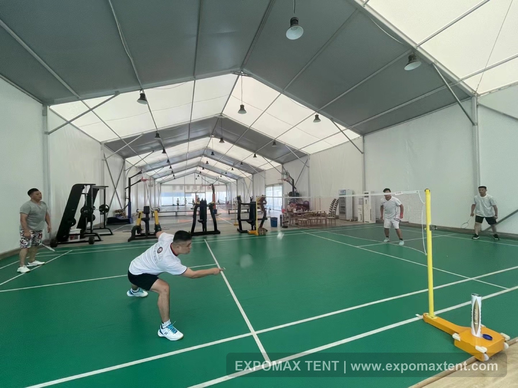 Badminton court inside a clear-span tent