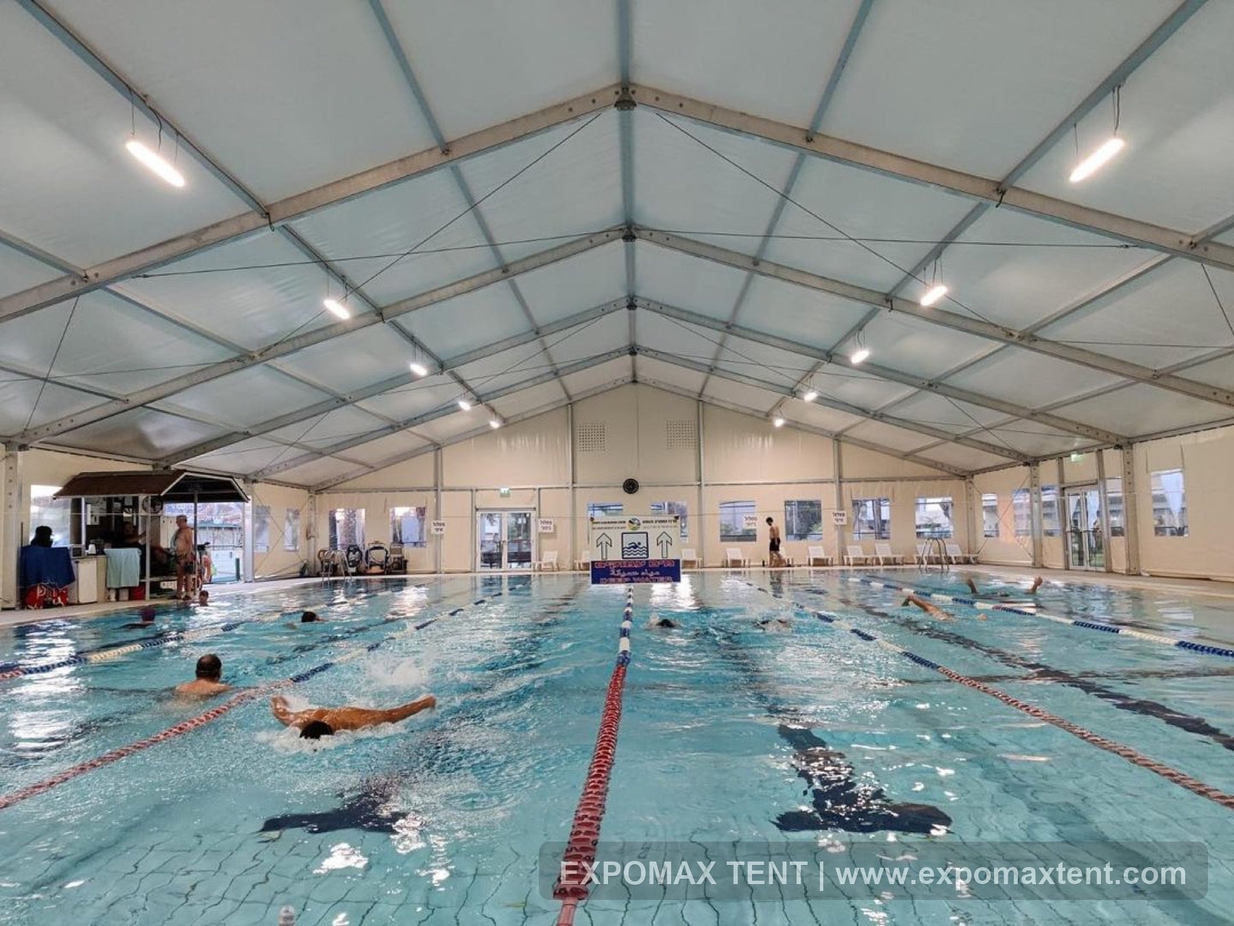 Swimming lanes inside a tent-covered pool