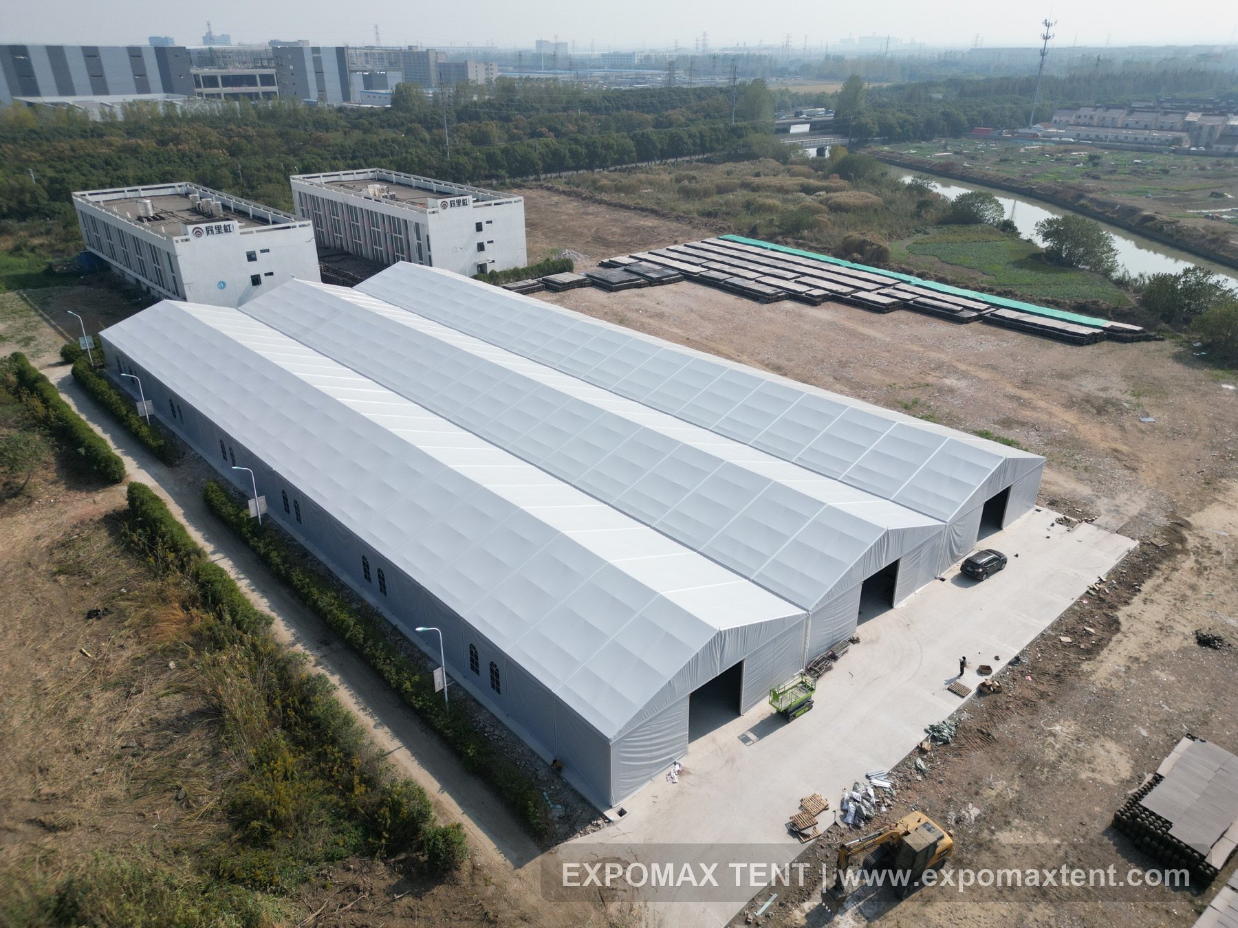 Aerial view of a large EXPOMAX warehouse tent