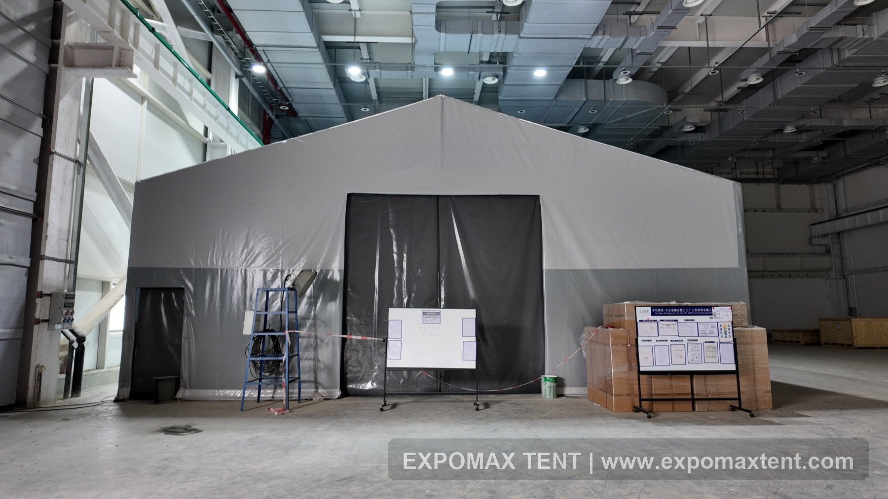 Insulated warehouse tent inside a factory building
