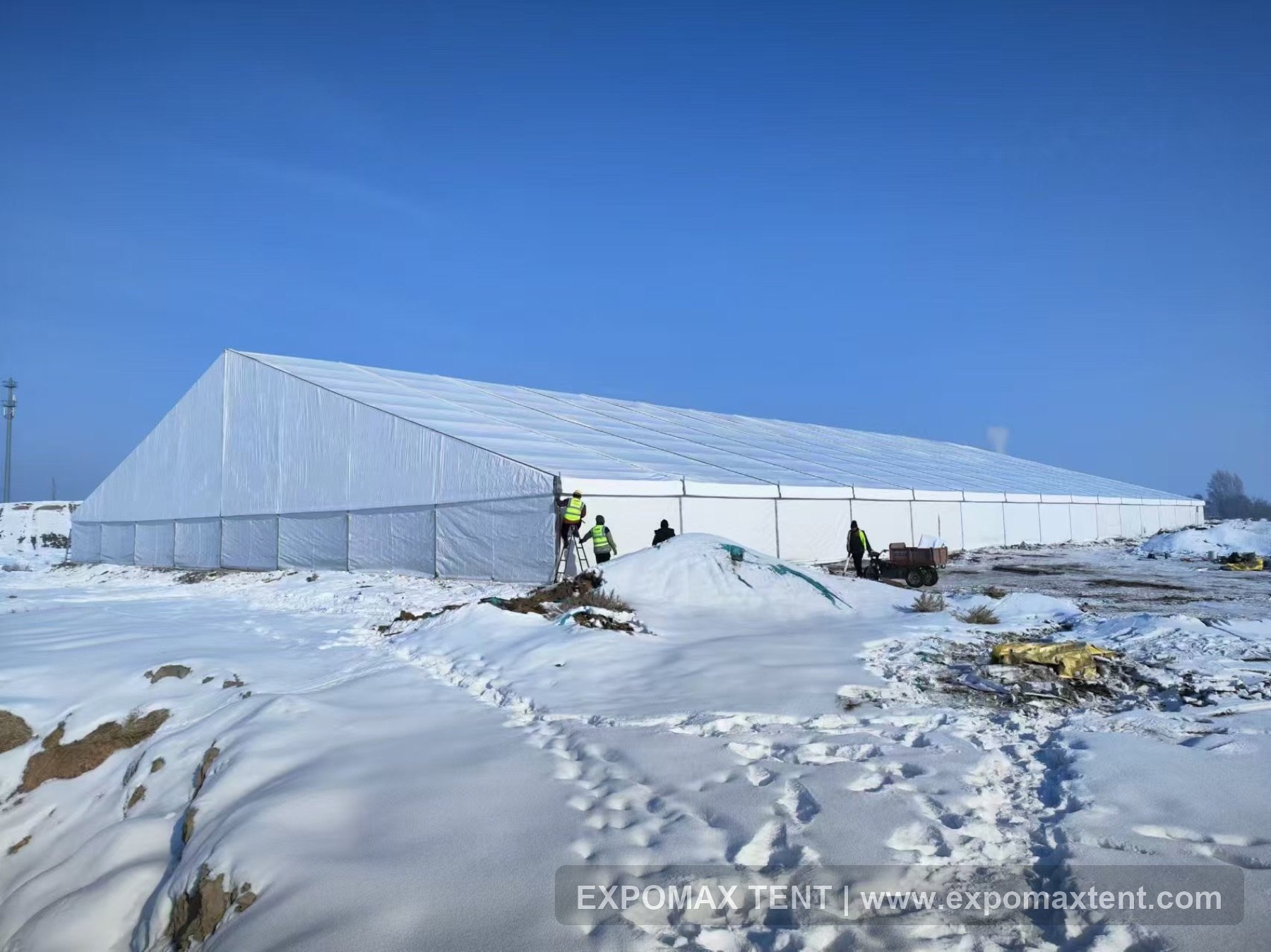 Large-span warehouse tent in snowy weather